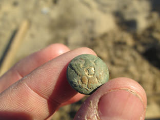 A Union infantry button recovered at Mitchelville.